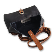 Adele Navy cross body bag with the buckle fastening open