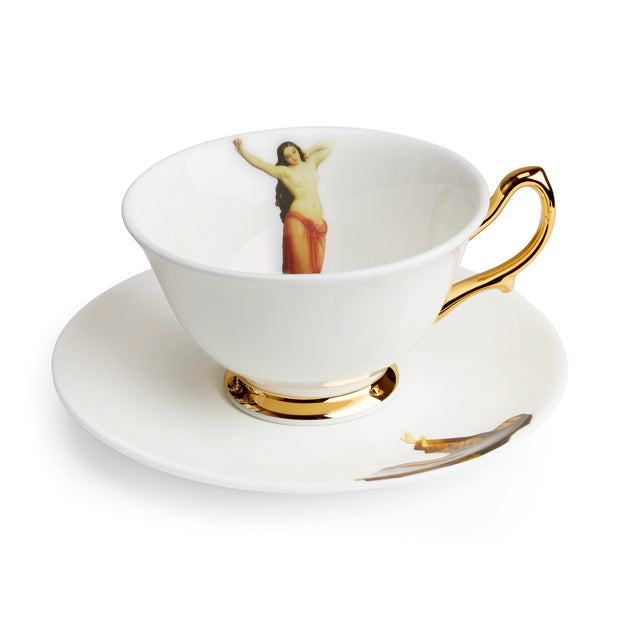 The Temptation Collection, Tea Cup and Saucer set by Melody Rose for the Wallace Collection. Made in the UK, in Fine Bone China with a hand-gilded finish. Side View.